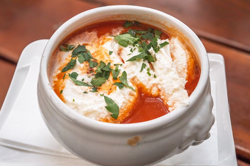 Tomato Basil Bisque soup served warm at Chopt